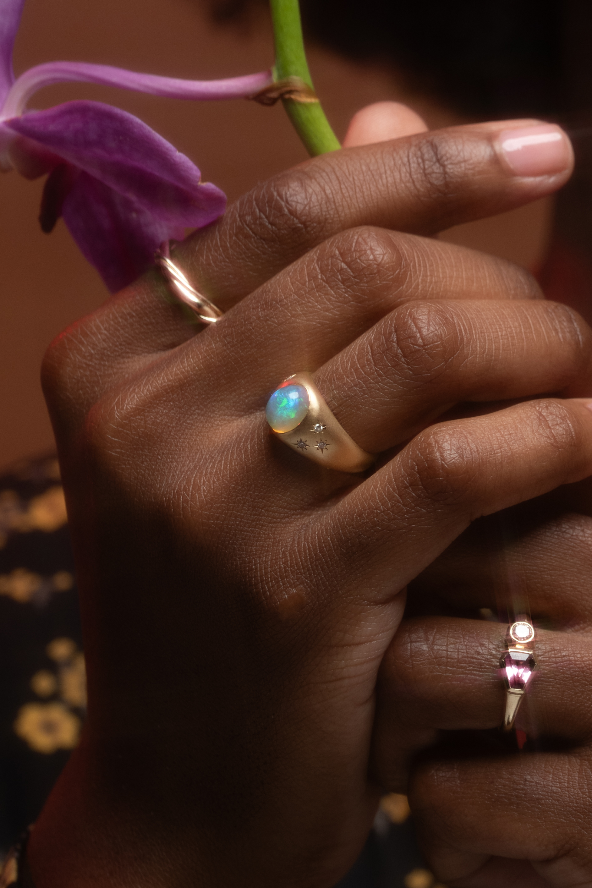 Model wears Nugget / Ring with other designer rings