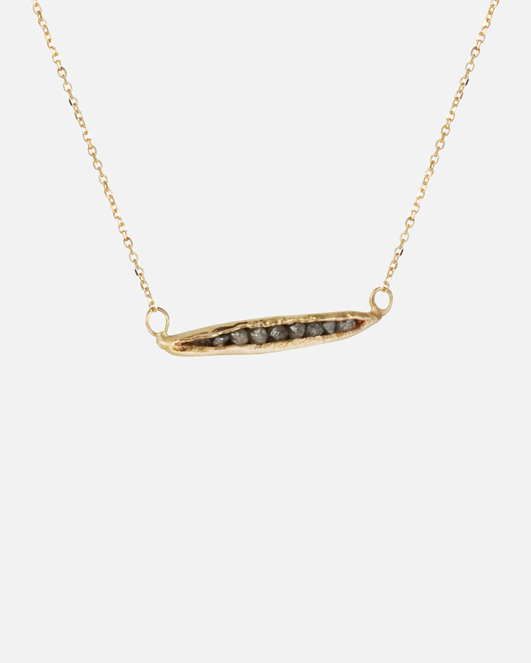 Side view of Rough Grey Diamond Pendant in 14k Yellow Gold