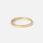 Angled view of Flat Band / 2mm Customizable in 14k yellow gold