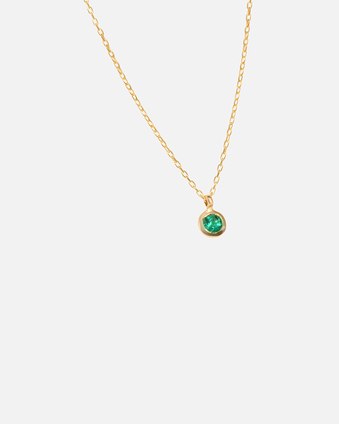 Side view of Emerald Round Pendant by Fitzgerald Jewelry