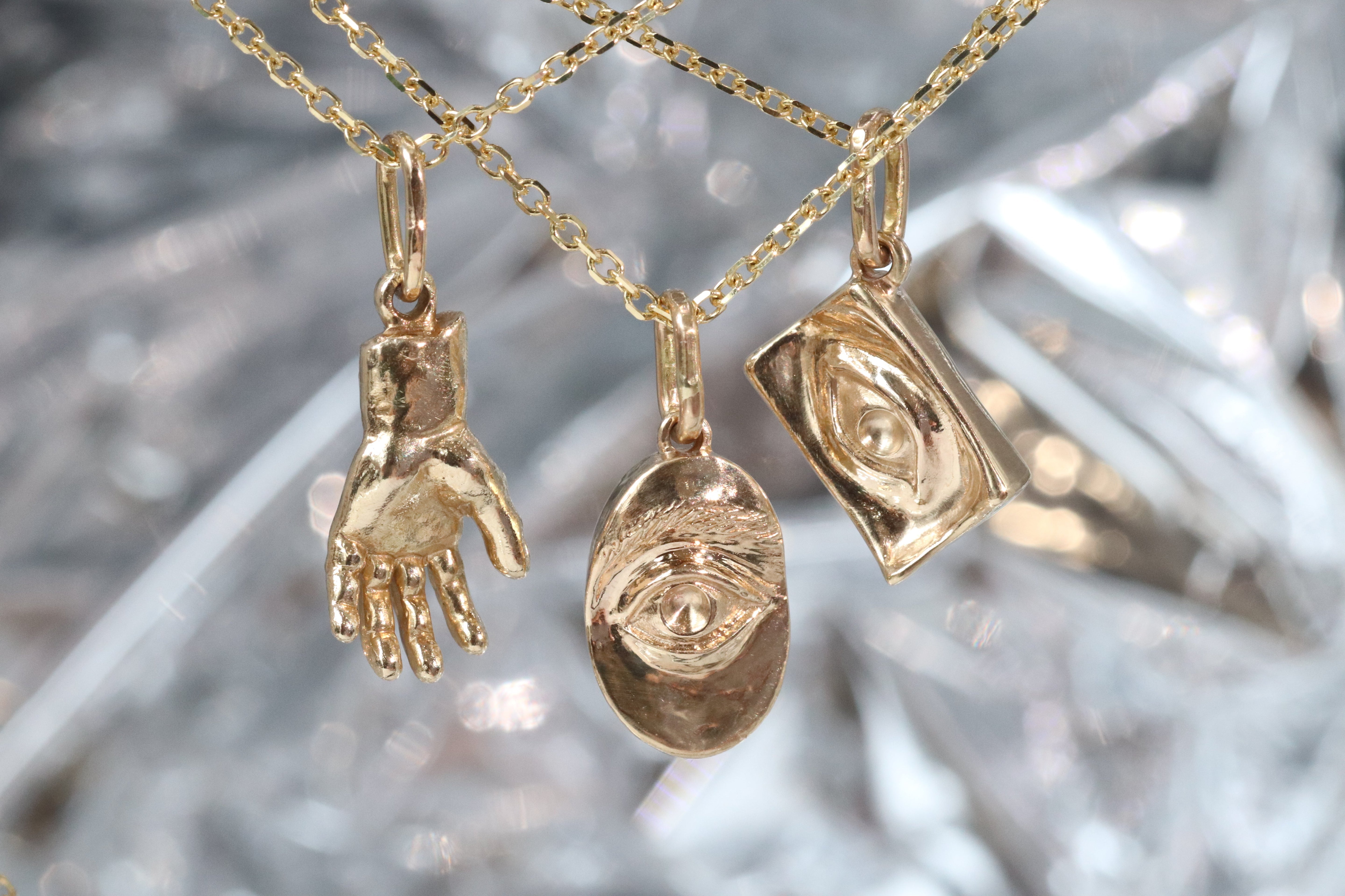 Group shout of Theia Pendant, Intagliaux Oval Pendant, and Intagliaux Pendant