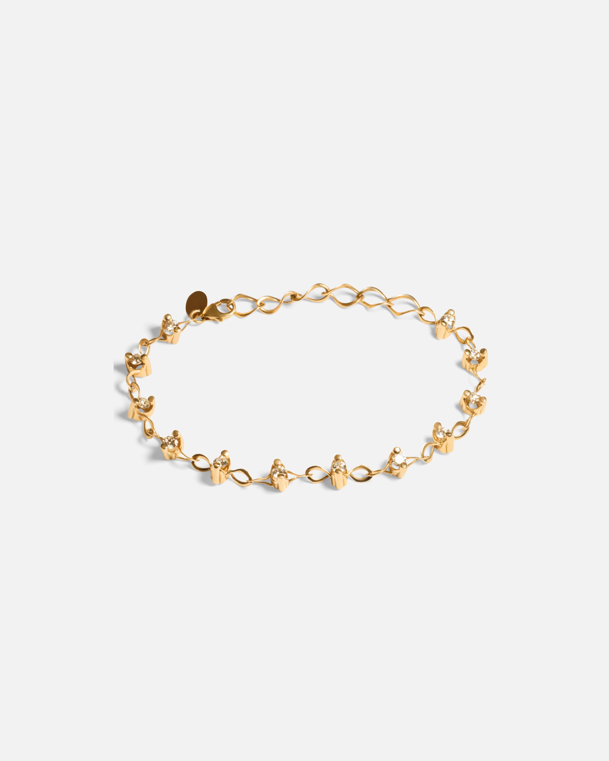 Side view of Locus Intermittendi Bracelet	in 14k yellow gold by Lucia B Marti