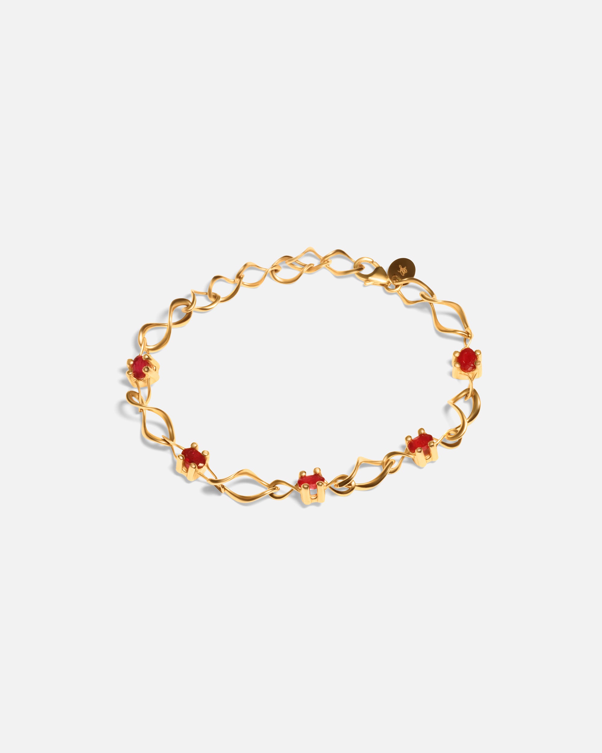 Side view of Nucleus Intermittendi Bracelet / Ruby in 14k yellow gold by Lucia B Marti