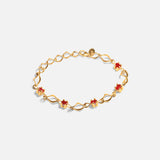 Front view of Nucleus Intermittendi Bracelet / Ruby in 14k yellow gold by Lucia B Marti