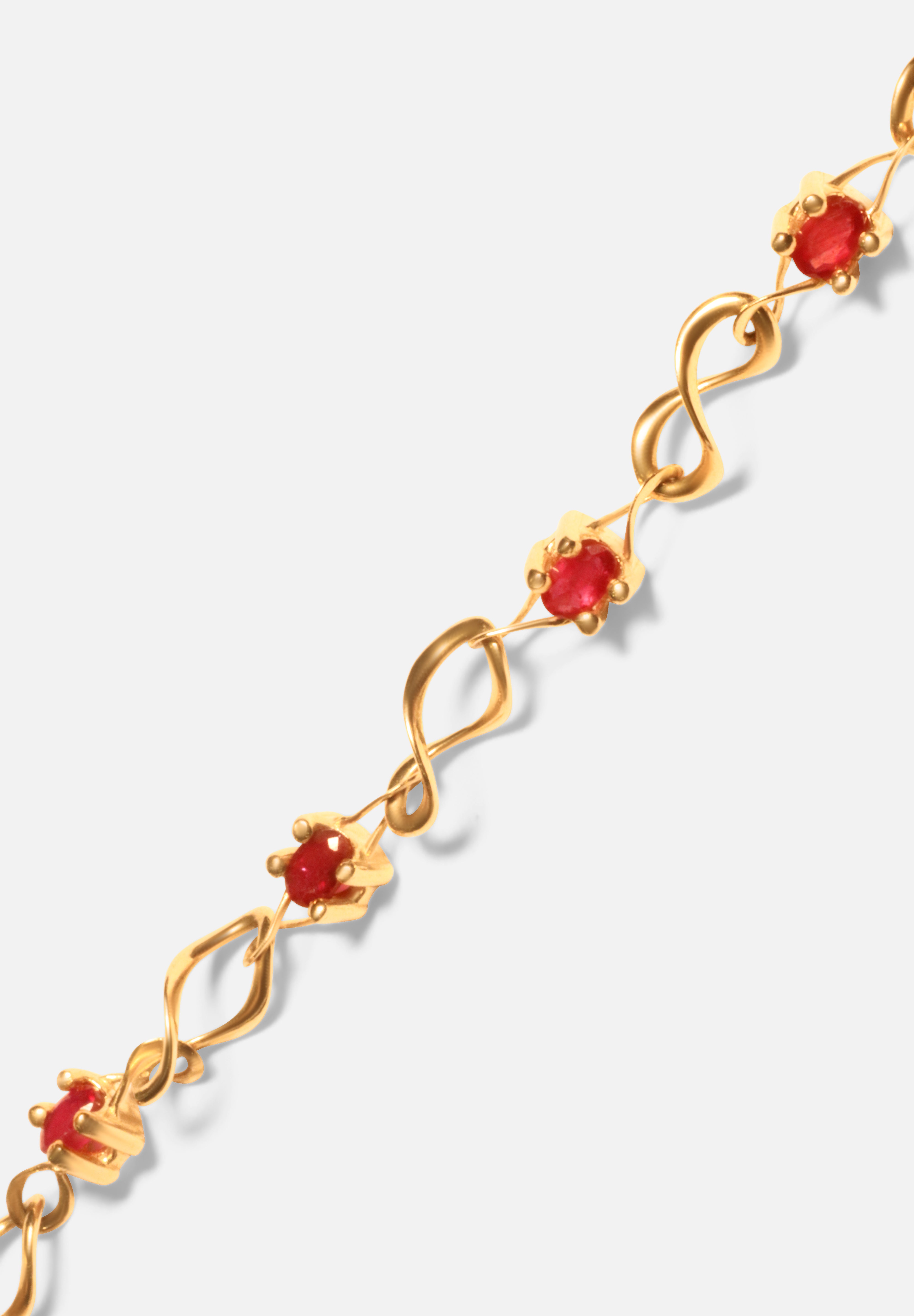 Close view of Nucleus Intermittendi Bracelet / Ruby in 14k yellow gold by Lucia B Marti