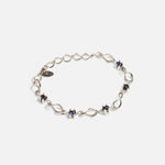 Side view of Nucleus Intermittendi Bracelet / Sapphire in 14k white gold by Lucia B Marti