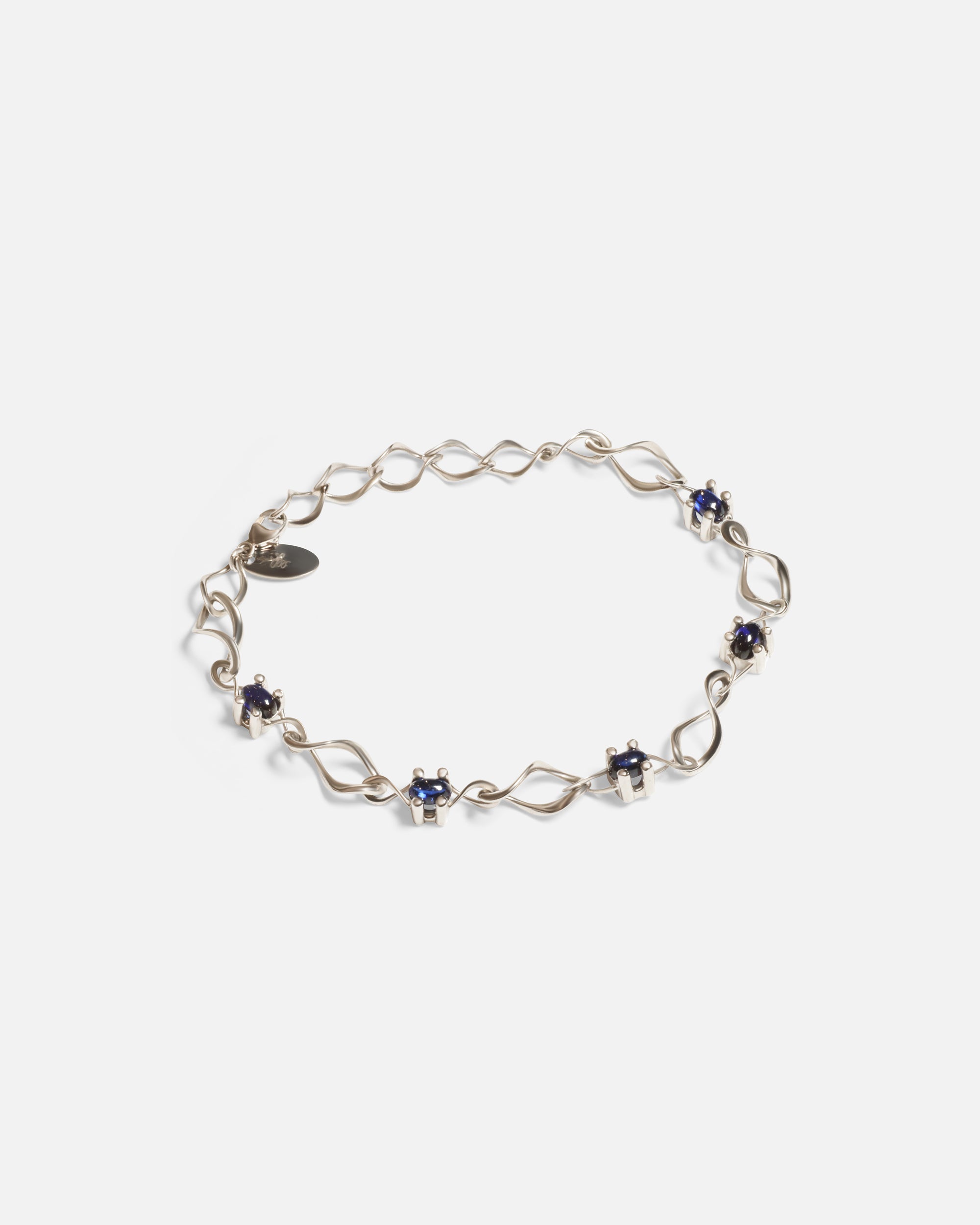 Side view of Nucleus Intermittendi Bracelet / Sapphire in 14k white gold by Lucia B Marti