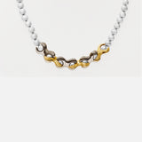 Front view of X Pearl Necklace / 6mm in 14k yellow gold and 14k white gold by Lucia B Marti