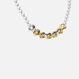 Side view of X Pearl Necklace / 6mm in 14k yellow gold and 14k white gold by Lucia B Marti