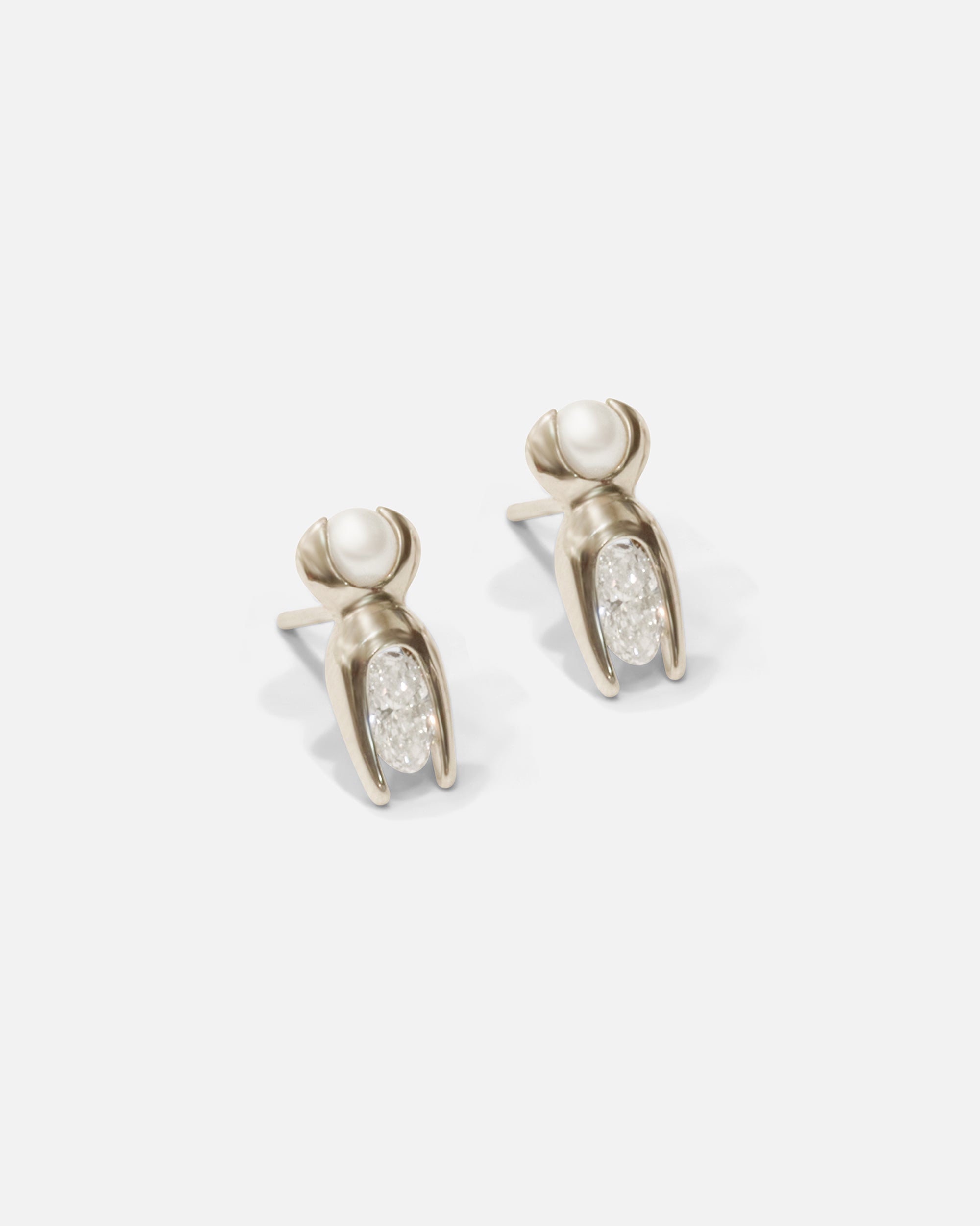 Side view of Mutation Earrings / White Gold by Lucia B Marti