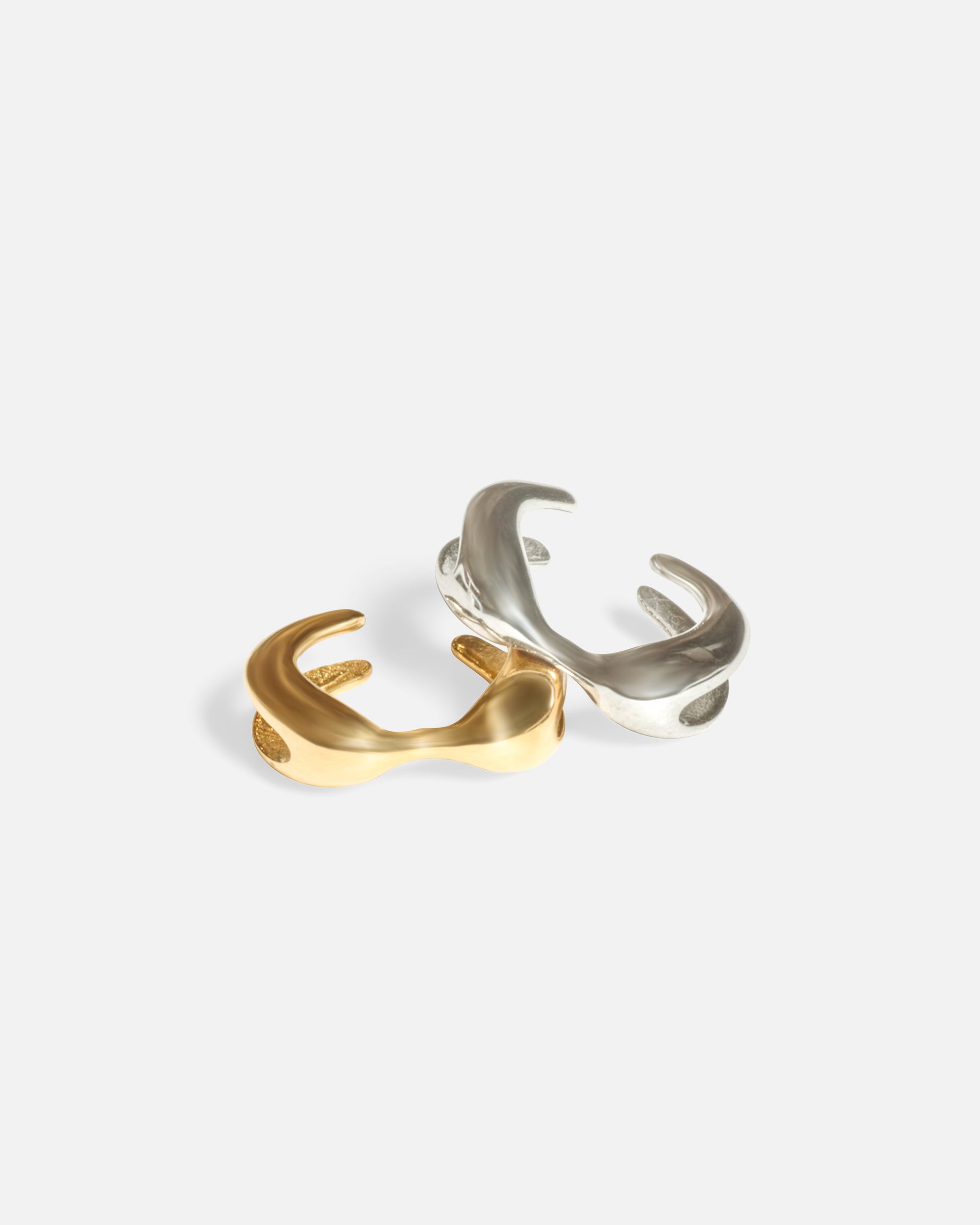 Group shot of X Earcuff by Lucia B Marti in 14k yellow gold and 14k white gold