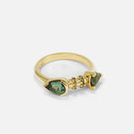 Side view of Calabash Nebula Teal Sapphire Ring