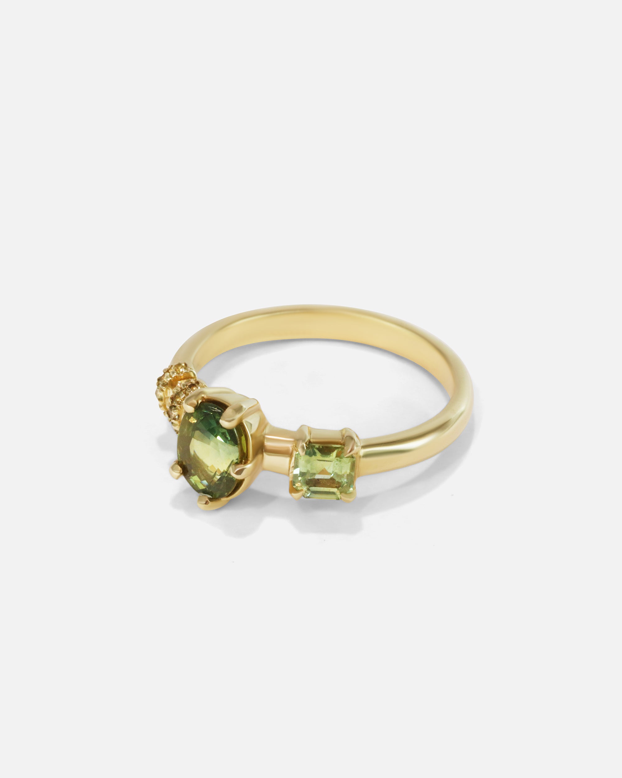 Side view of Monoceros Nebula Green Asscher Sapphire Ring